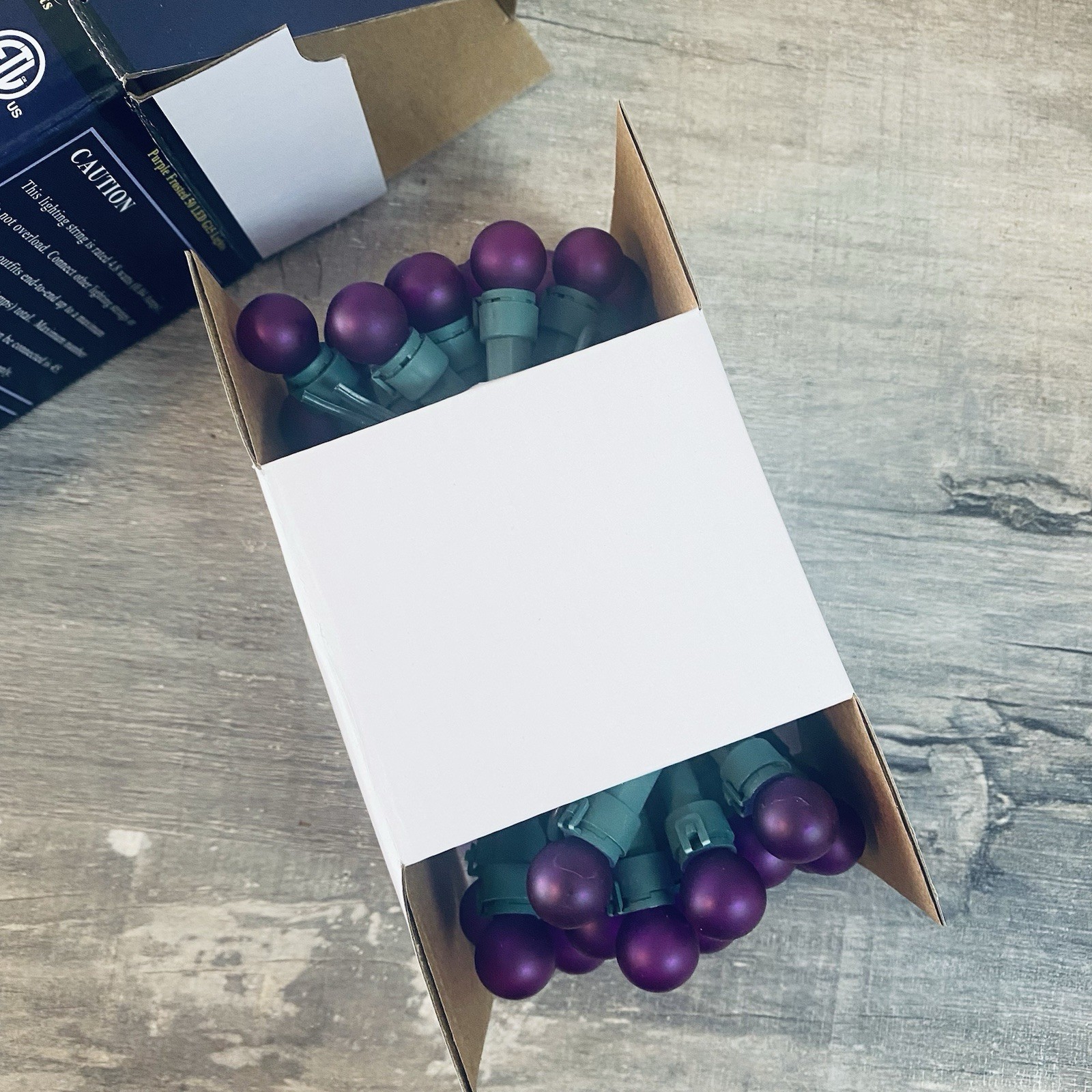 String of Purple Frosted 50 LED G15 Lights Suitable For Indoor And Outdoor Use