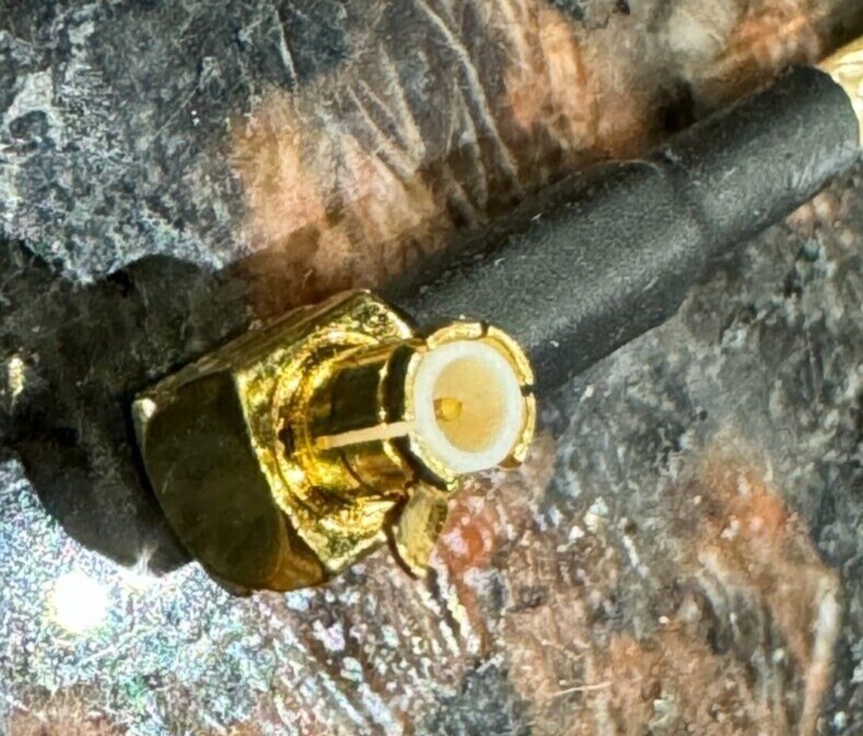 LumenRadio's MCX to RP-TNC [model#: 102-2003] is a 25cm indoor-rated coaxial cab