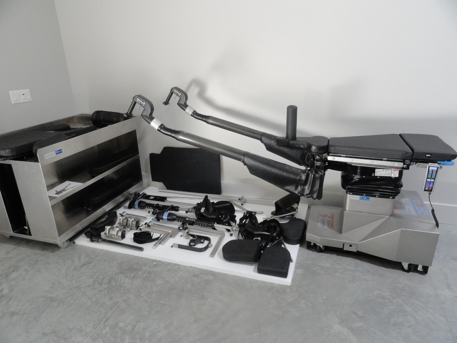 The STERIS OT1100 Surgical Fracture Orthopedic Table with accessories & cart