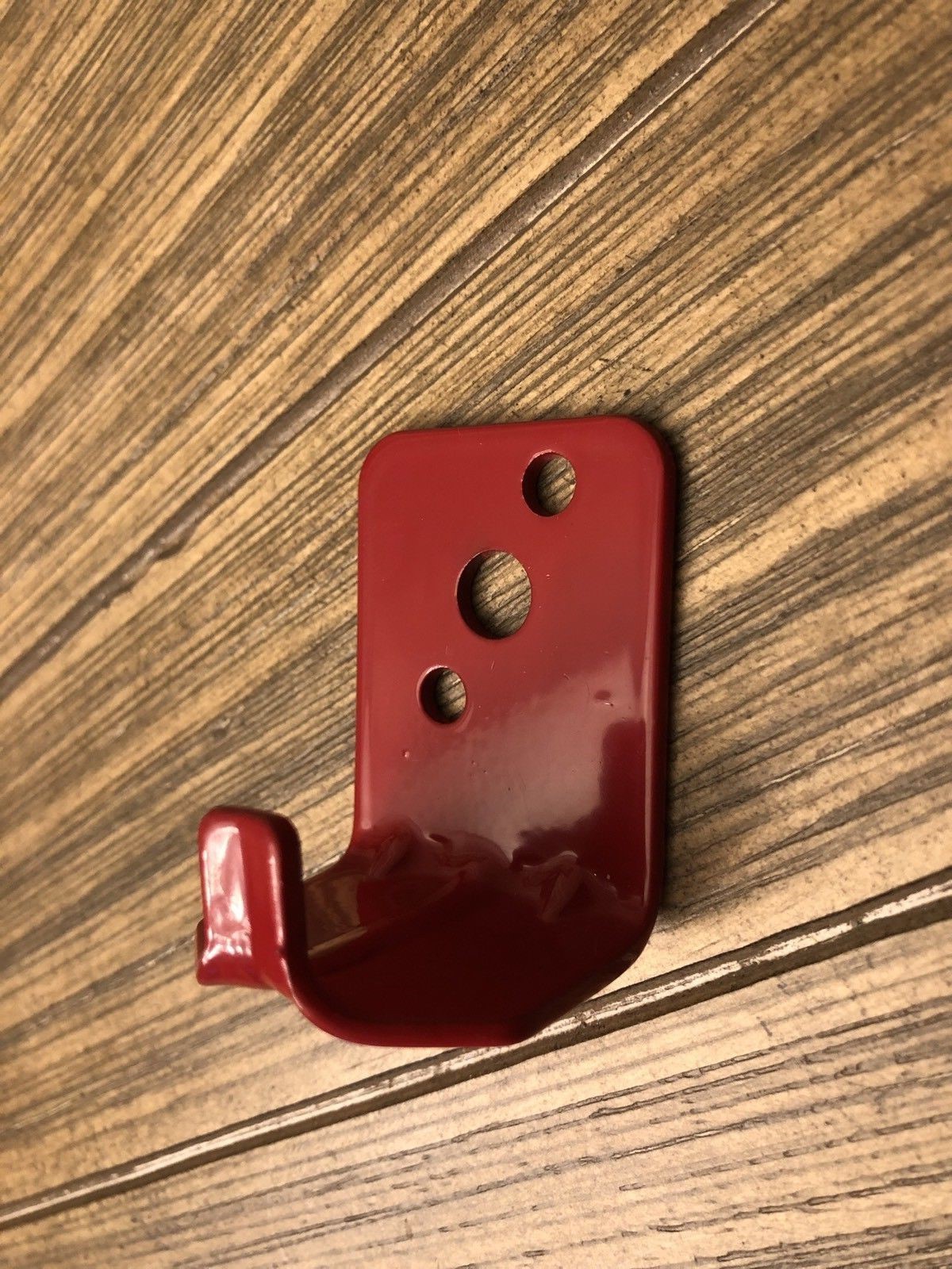 Fire extinguisher wall mounting bracket for 10 to 20 lb. extinguishers.