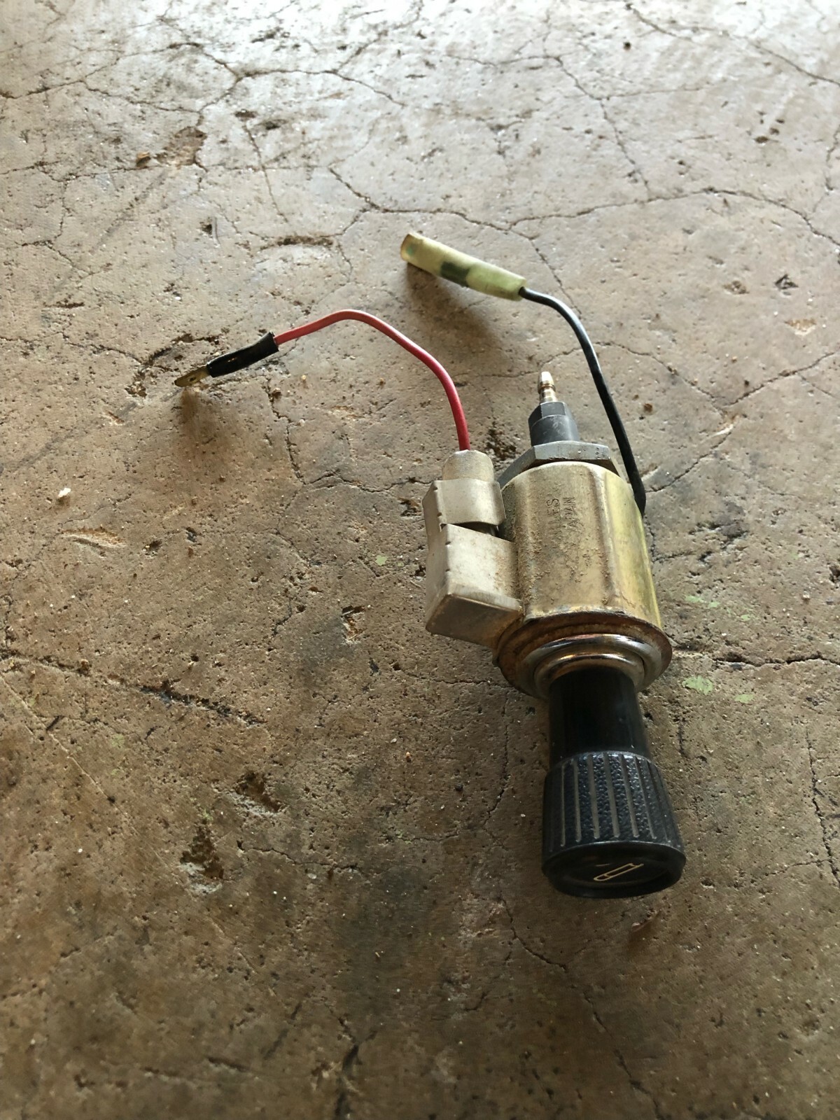 1971-1973 Datsun 240Z cigarette lighter assembly.