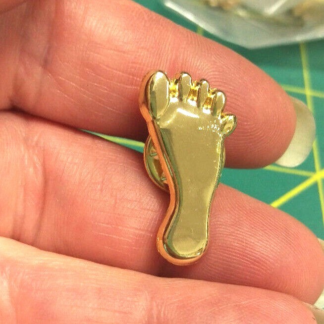 NEW Bigfoot lapel pin with a gold Sasquatch foot print for the shape of the pin