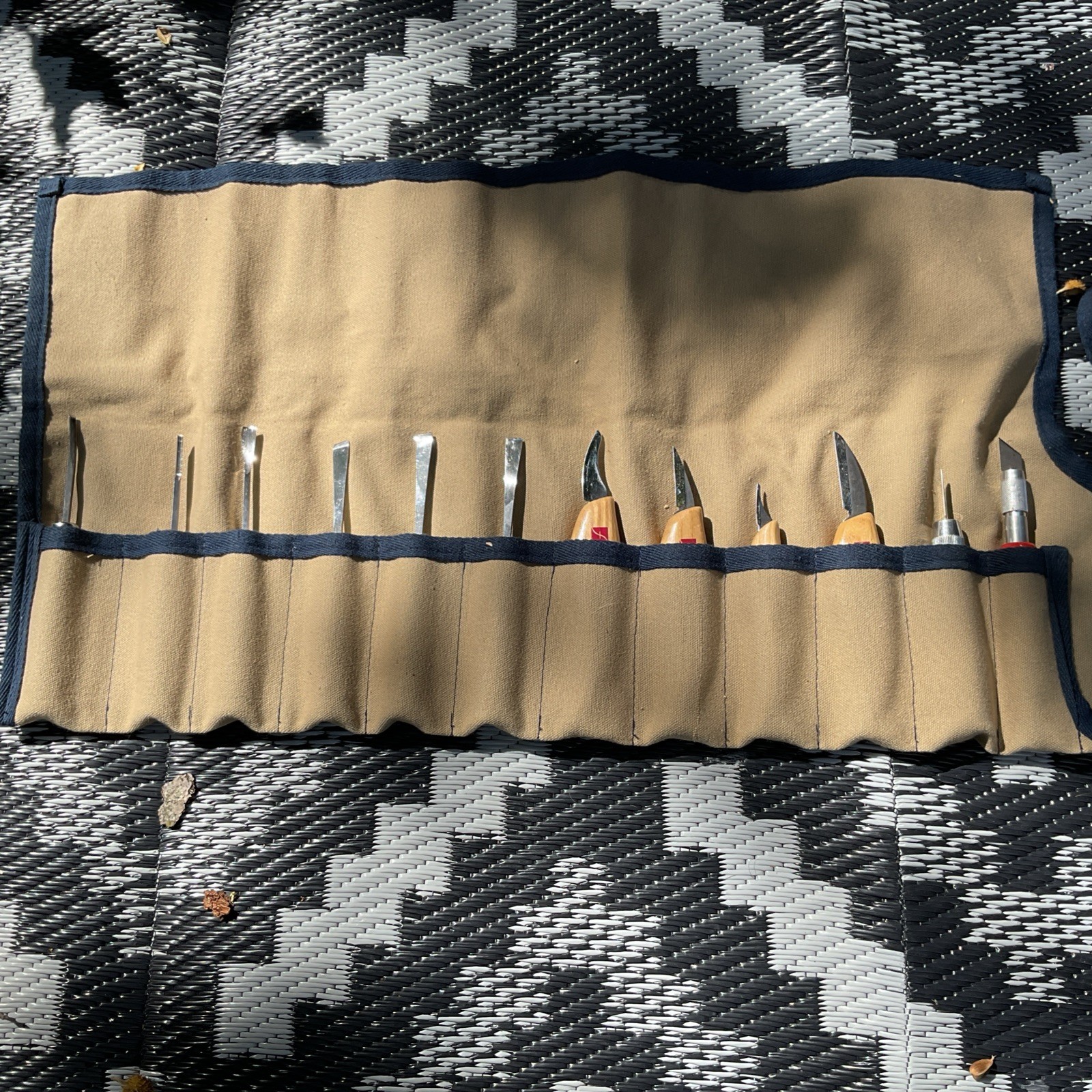 A Set Of Wood Carving Tools ( Ramelson, Flexcut, 2 Misc) with canvas carrier