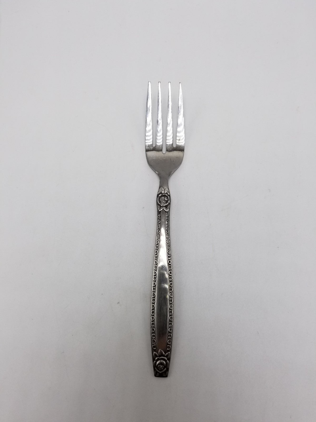 Nasco 'Rose Border" 6 3/8 Inch Stainless Individual Salad Fork (National)