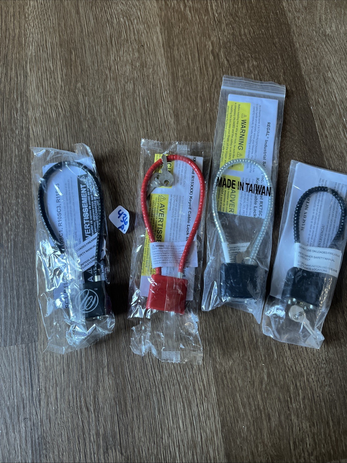 4- GUN CABLE LOCKS WITH KEYS MIXED LOT NEW