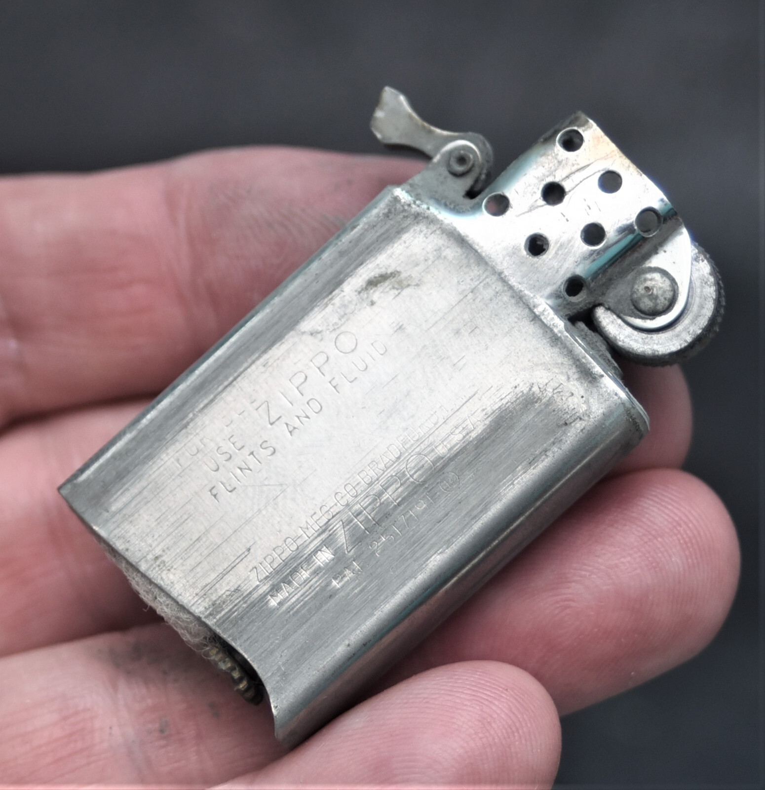 VINTAGE CHAMPLIN KEEPS THINGS MOVING ZIPPO SLIM FLAT BOTTOM IIII IIII