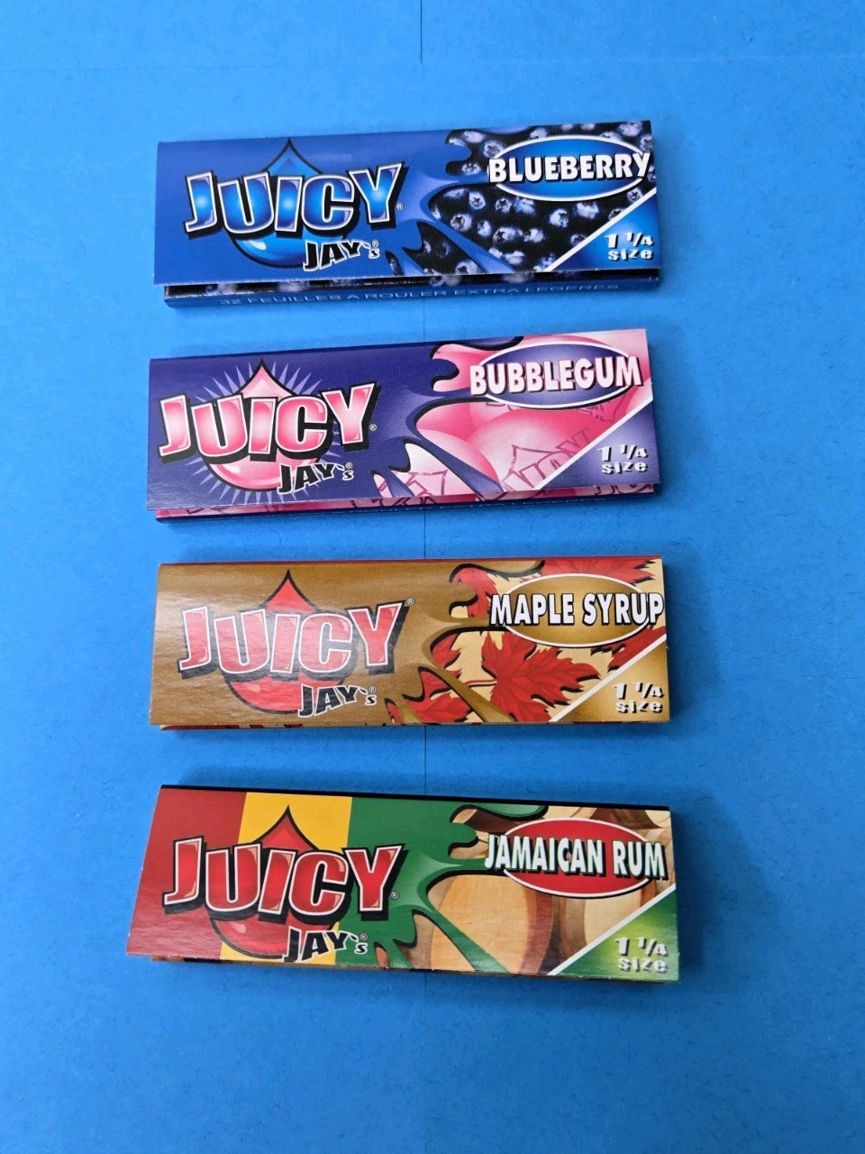 Juicy Jay's 1 1/4 Size Flavored Rolling Paper Bundle 4 Packs of 32 Papers