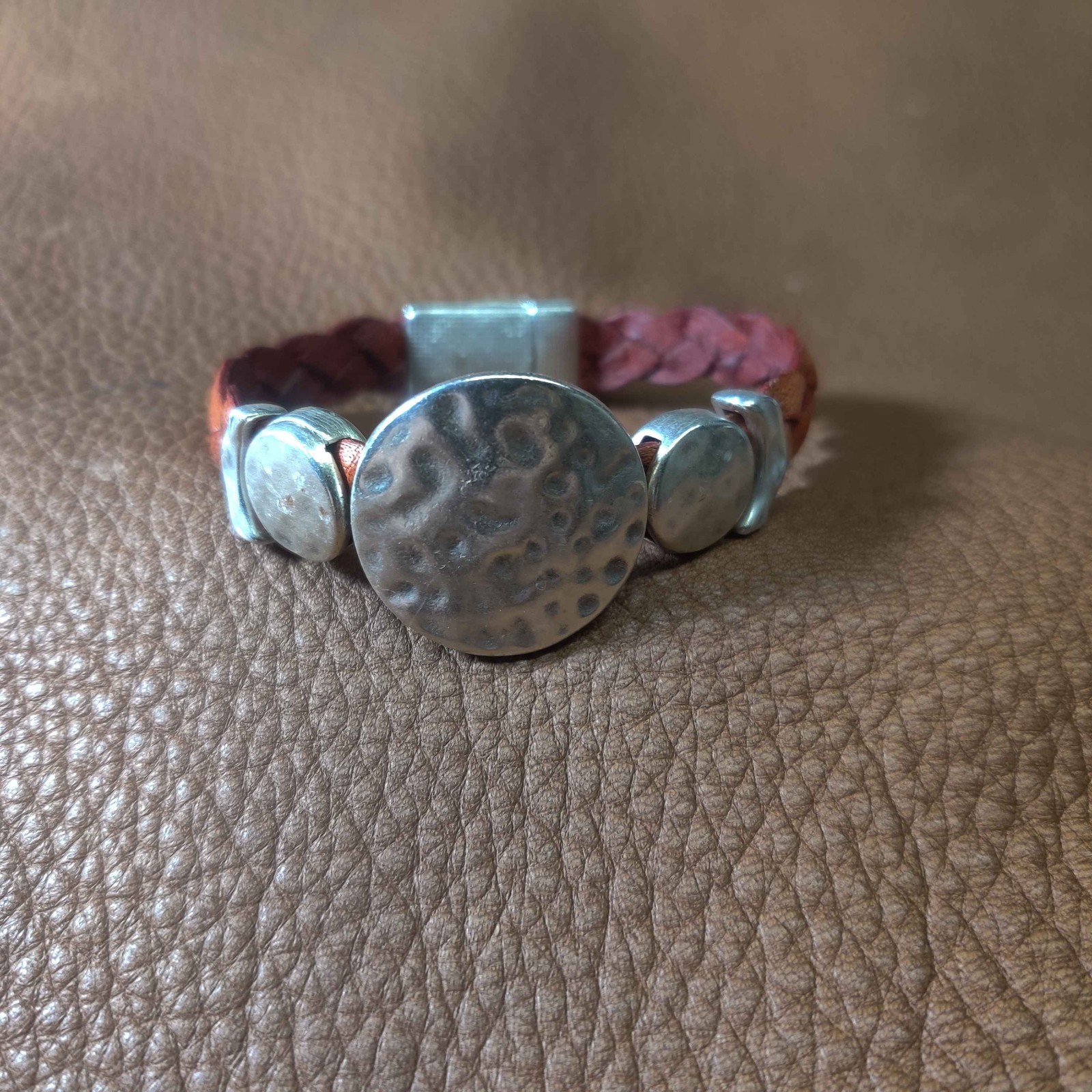 Hand crafted leather bracelet with pounded pewter disc with magnetic closure
