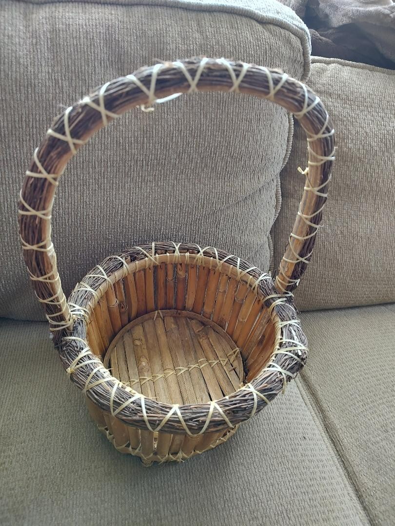 woven round 2 tone bamboo basket 12" tall 8" across with handle