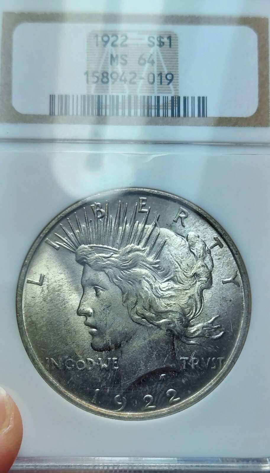 1922-P Silver Peace Dollar NGC MS 64 (Light Copper Toning Obverse)