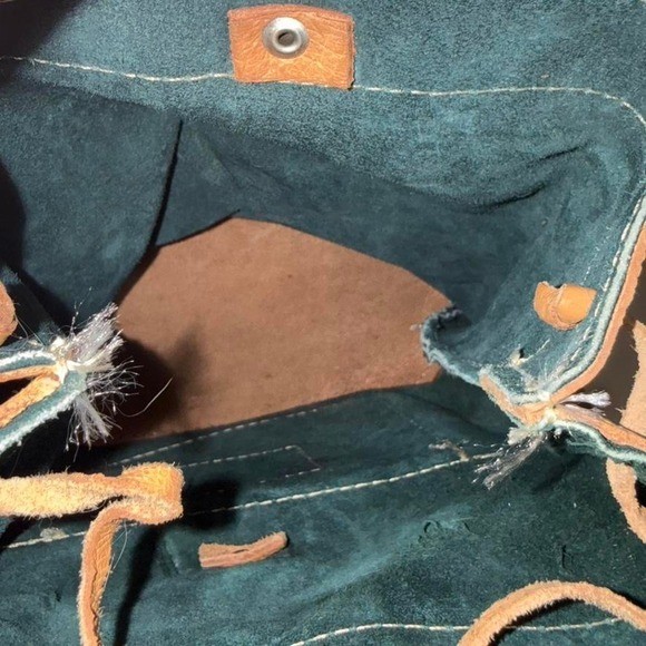 Forest Green Suede and Tan Leather backpack with adjustable straps.