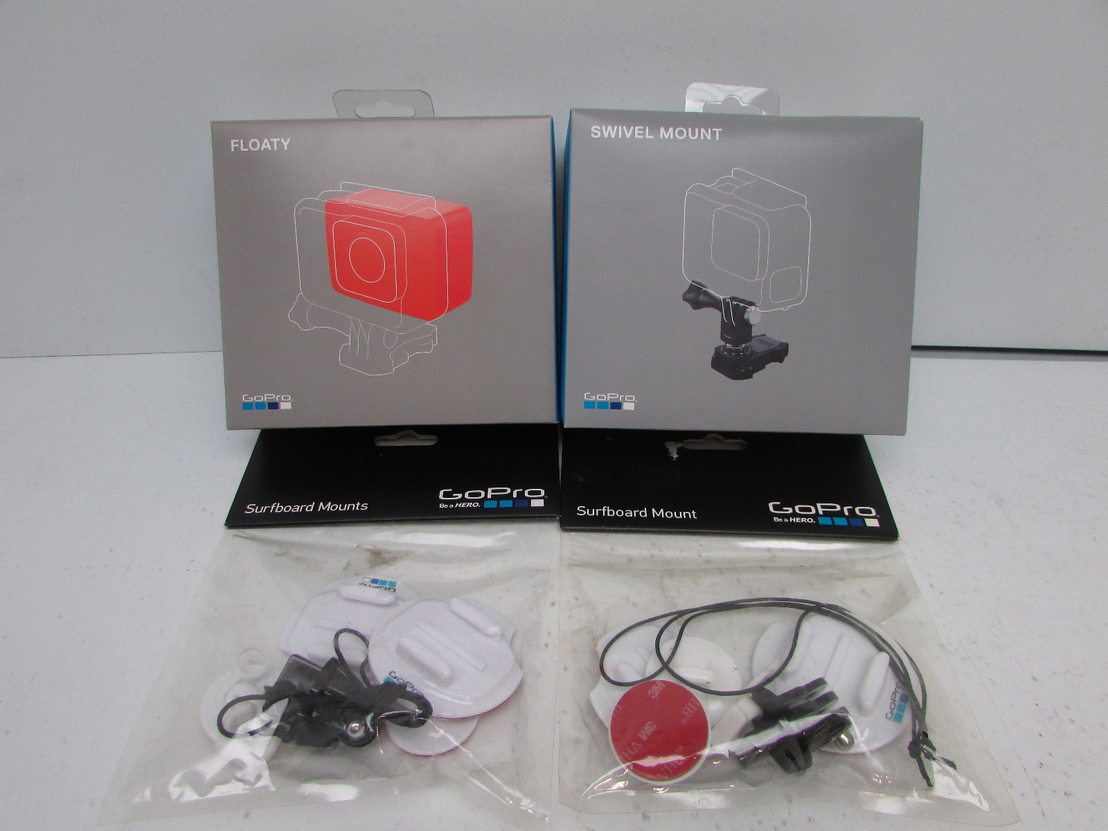 Lot of 4 Go Pro Accessory's Swivel Mount, Float, and 2 Surfboard Attachments