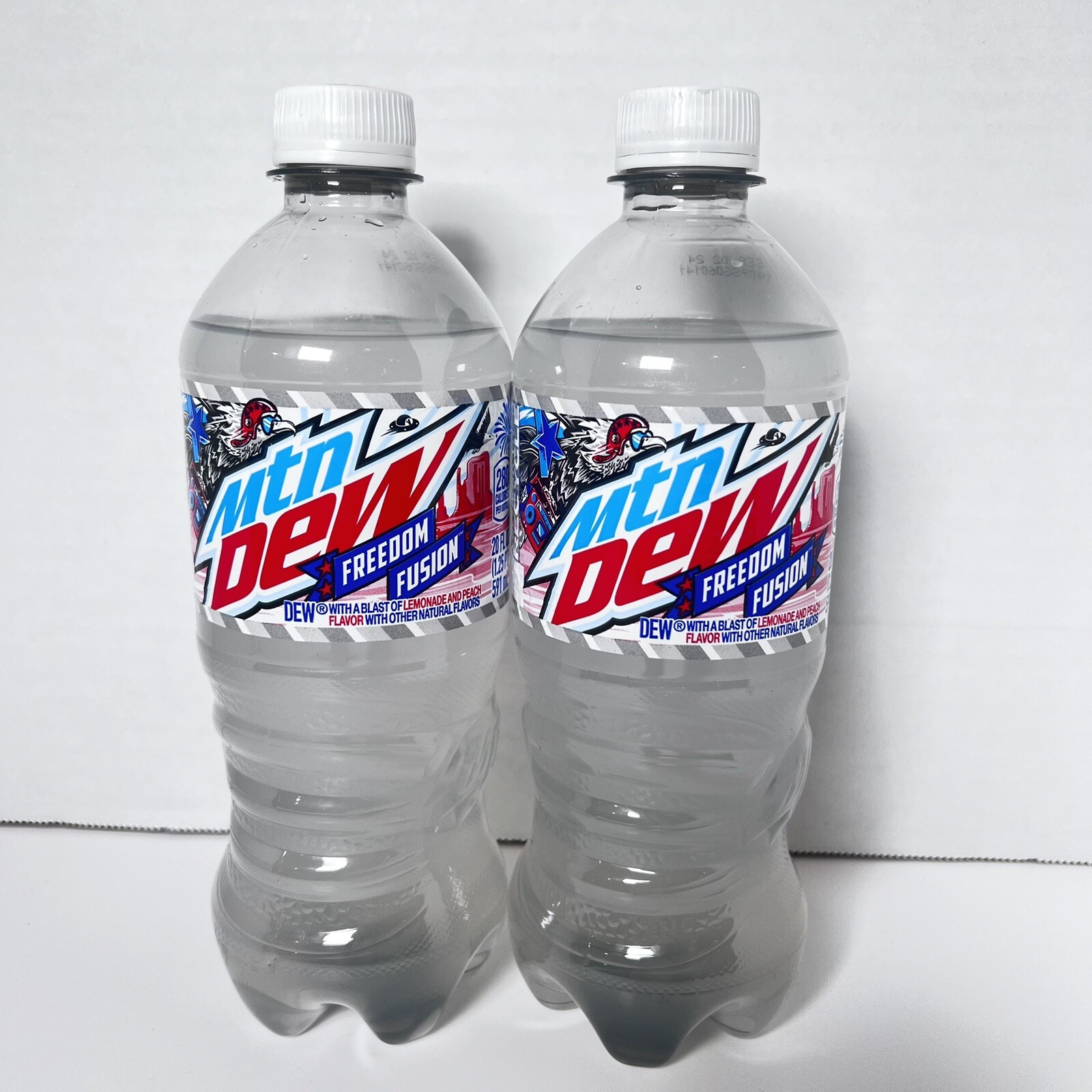 NEW MTN DEW FREEDOM FUSION LEMONADE AND PEACH FLAVOR SODA 2 - 20 FLOZ BOTTLES
