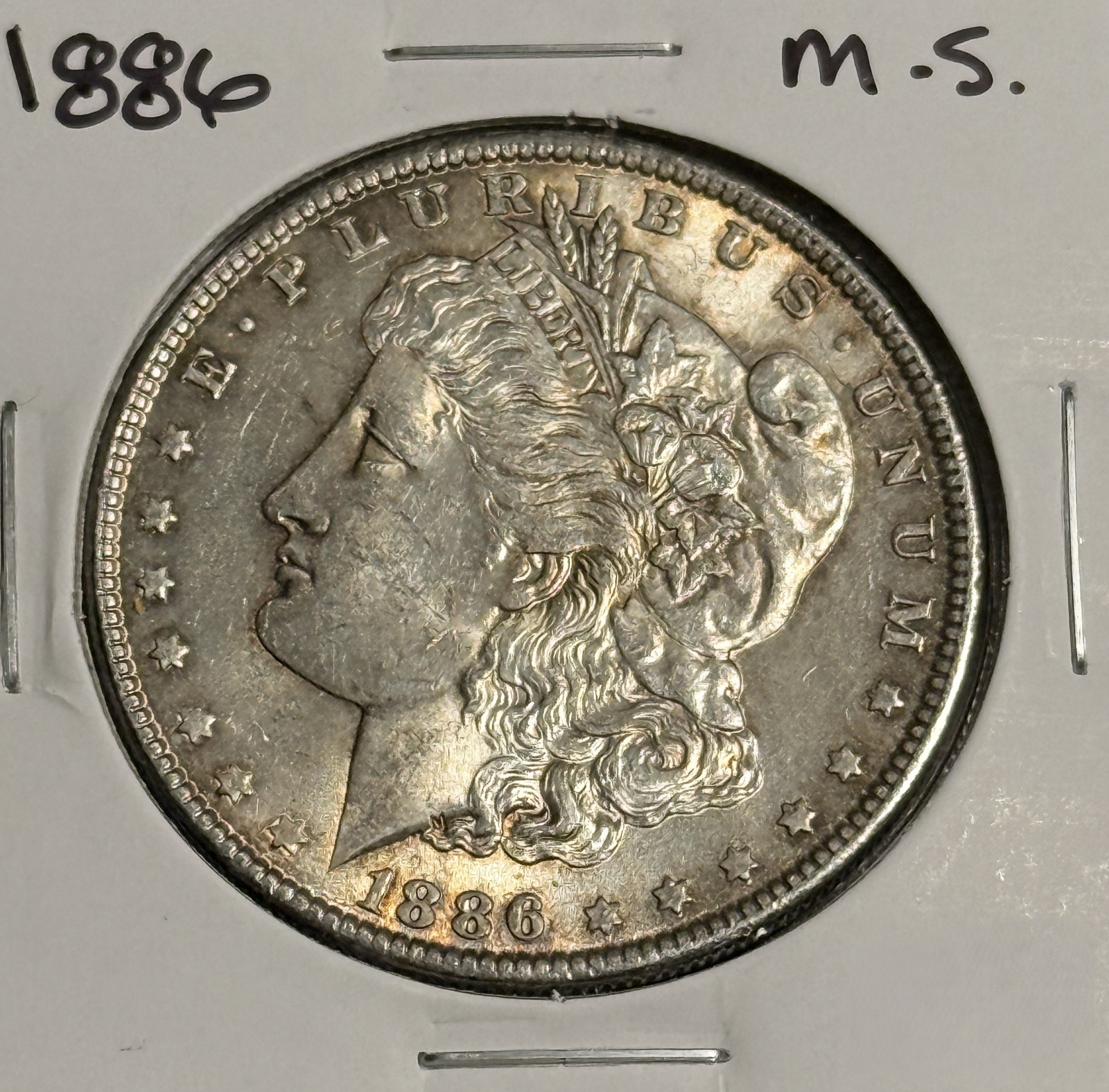 1886 Morgan Silver Dollar, Unc Details. (18944)