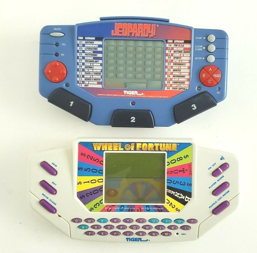 Lot of 2 Electronic Handheld Games Jeopardy & Wheel of Fortune Instruction WORKS