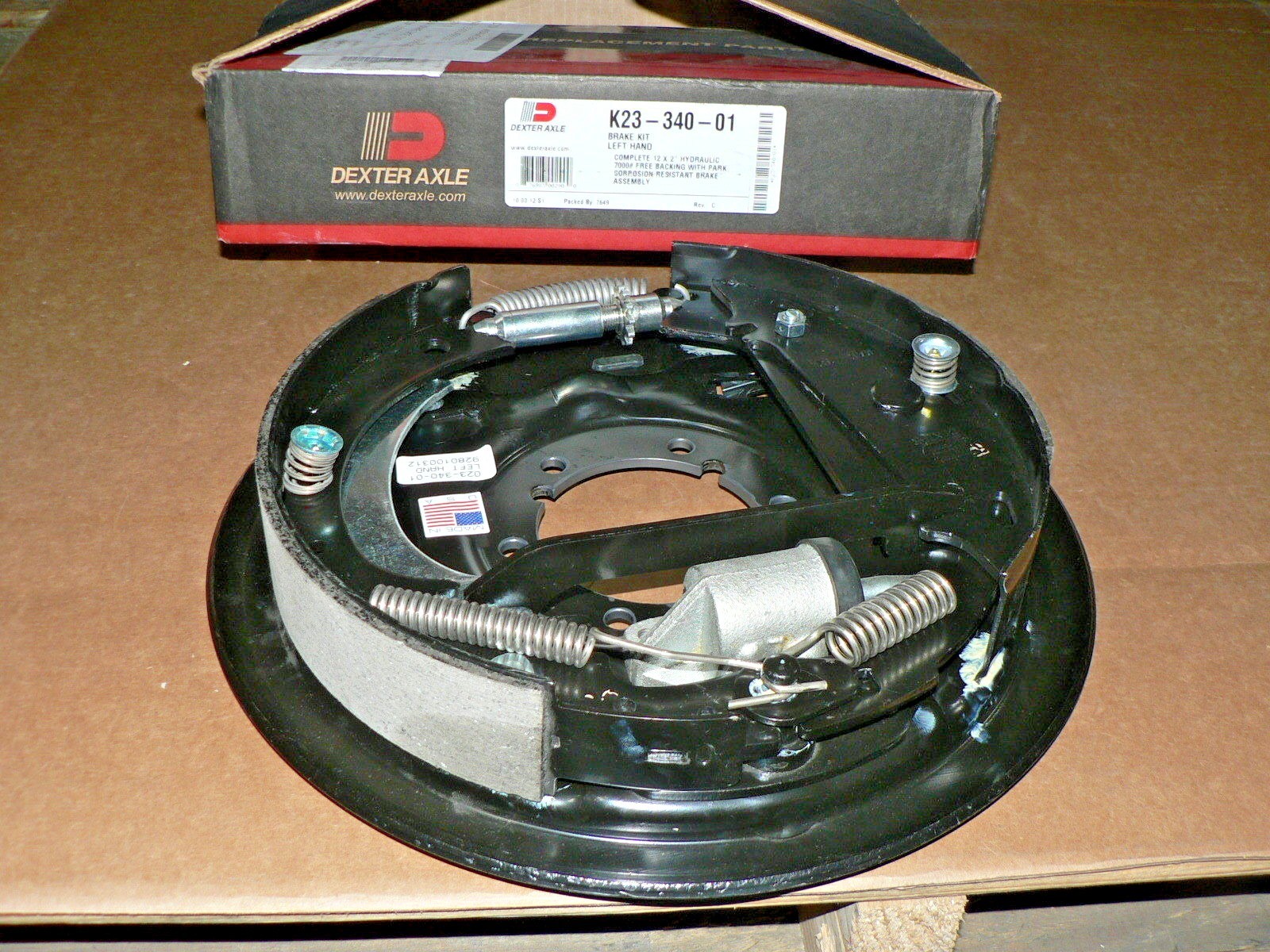 DEXTER Complete 12" x 2" hydraulic 7000# free backing with park brake assembly.
