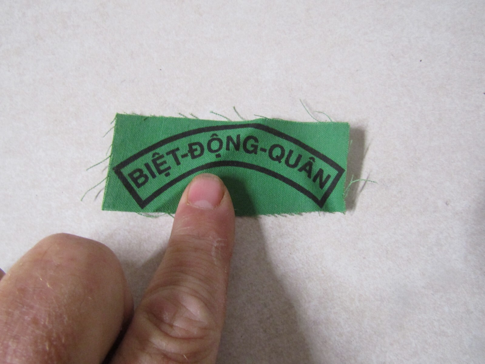 MILITARY PATCH OLD VIETNAM ERA STAMPED ON CLOTH BIET DONG QUAN BLACK ON GREEN