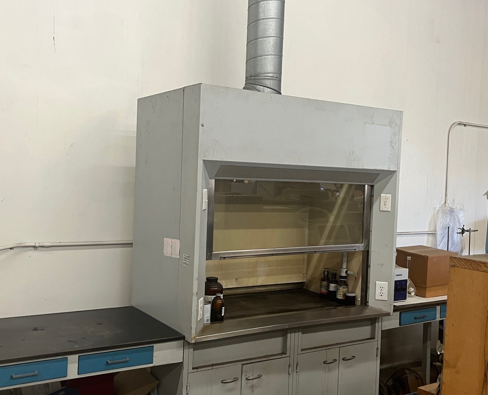5' fume hood with storage cabinet, side tables and blower