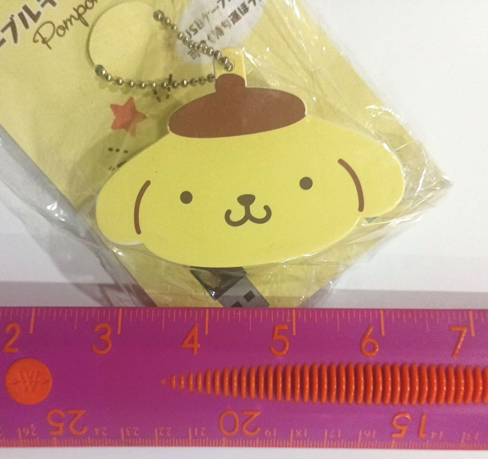 Sanrio pompompurin cable holder.