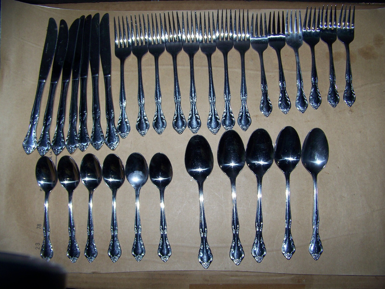 32 Pieces Of Stainless Flatware With Roses & Scrolls On The Handles, Korea