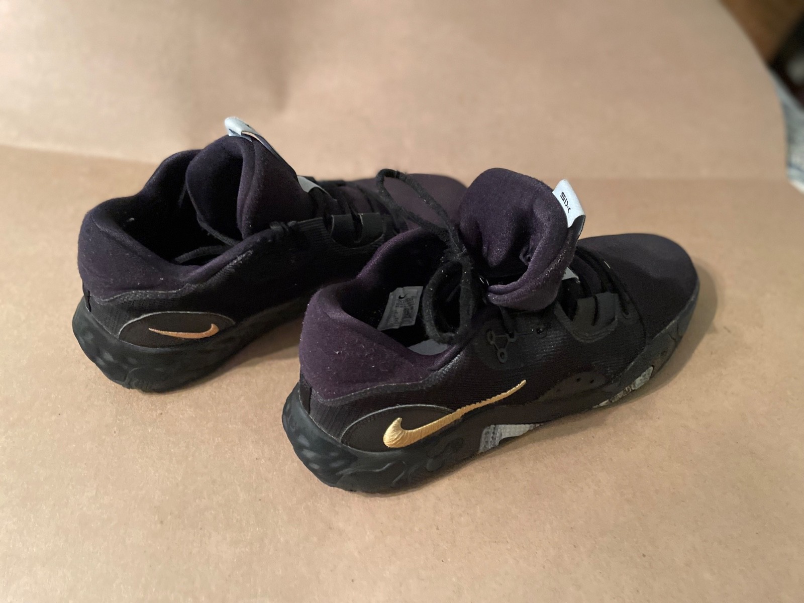 Nike Paul George black & gold size 14