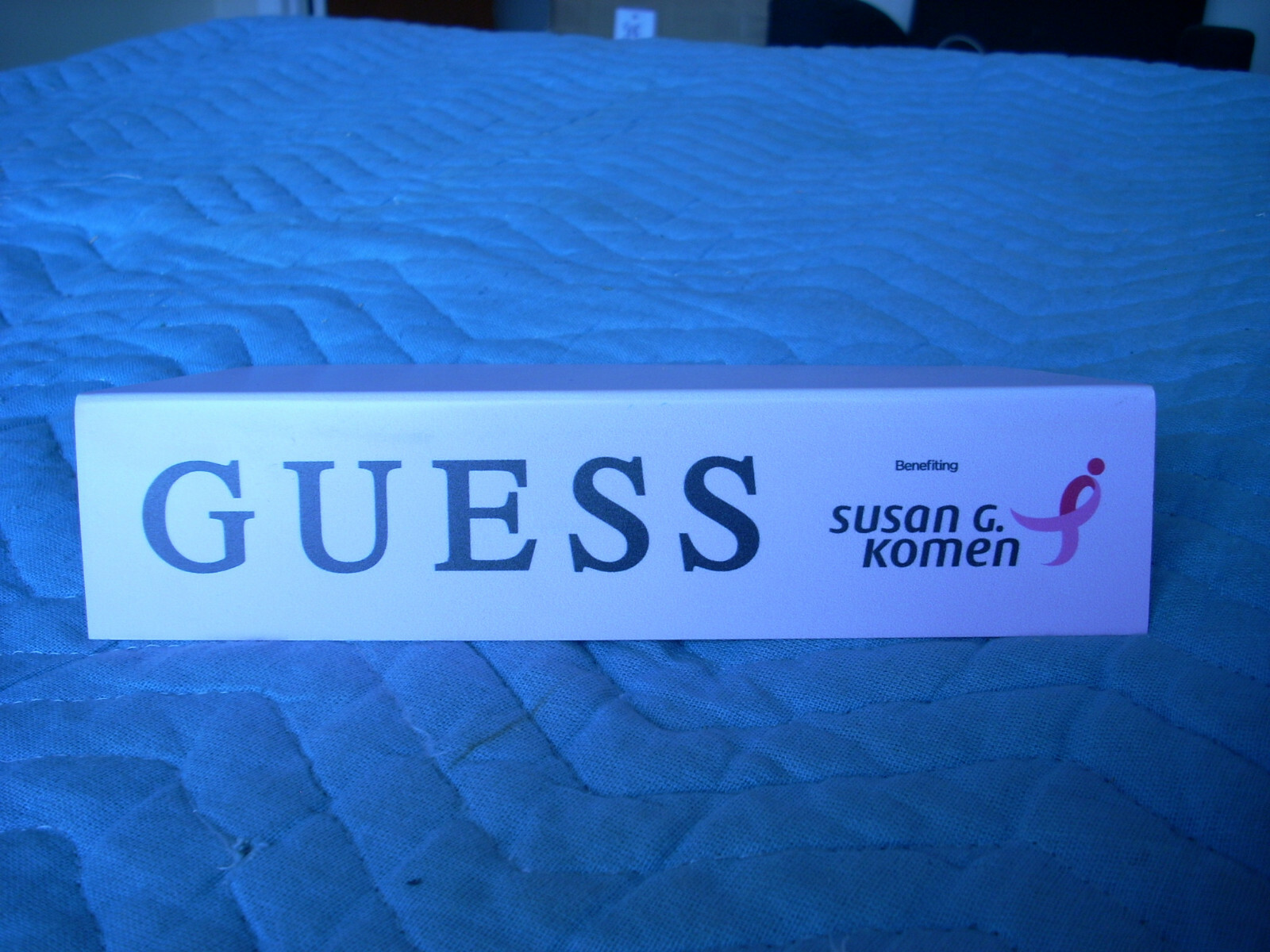GUESS ADVERTISING SHELF/ TABLE END INSERT PROMOTING SUSAN G. KOMEN FOUNDATION