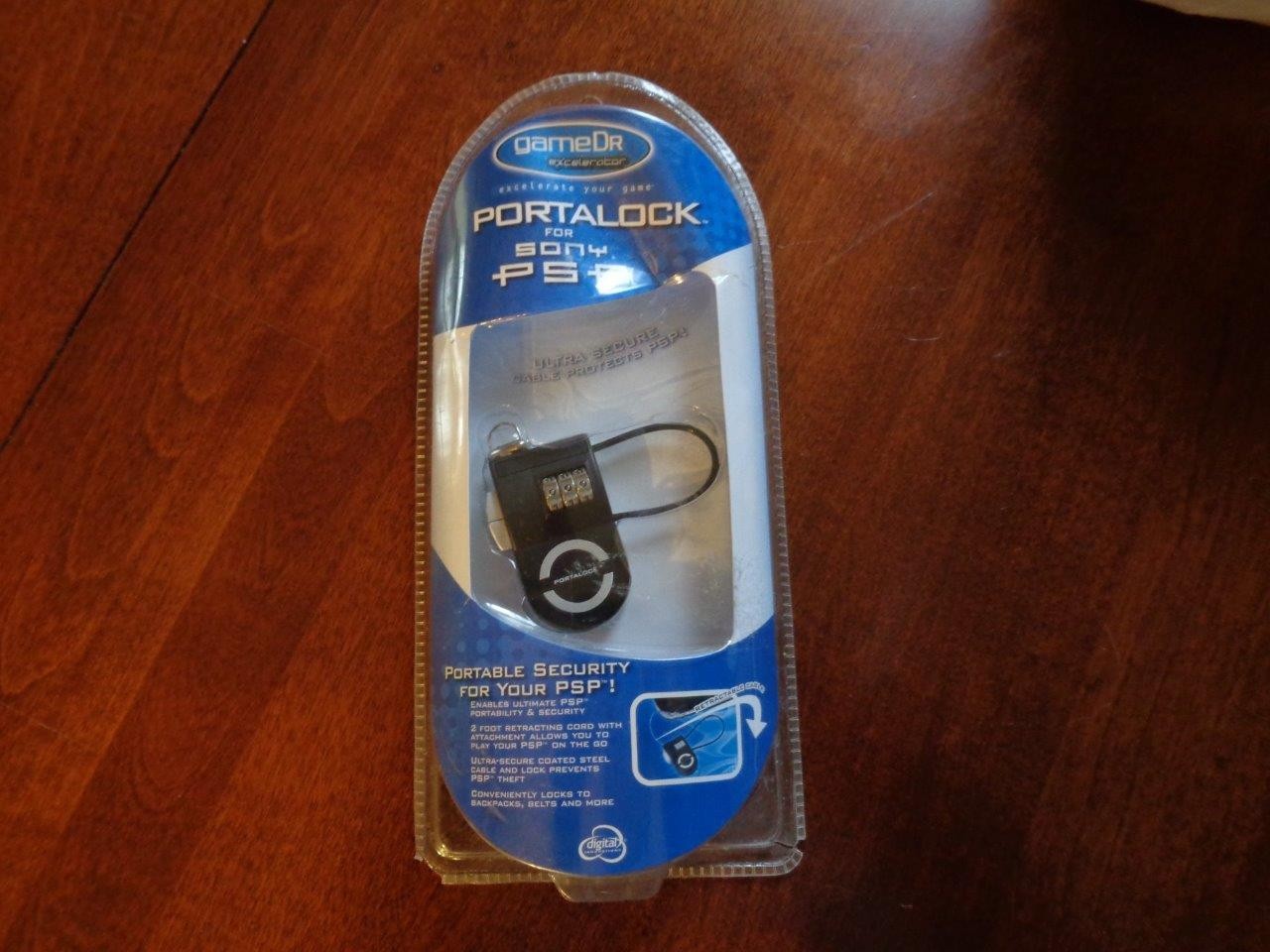 Sony Portalock for Sony PSP etc.  2' retractable attachment cable + 3 dial comb