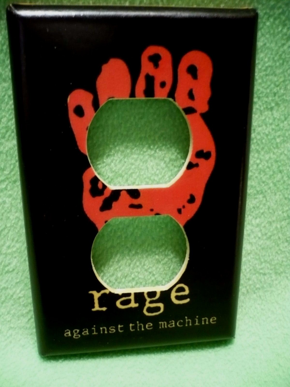 RAGE AGAINST THE MACHINE design wrapped paper outlet cover.