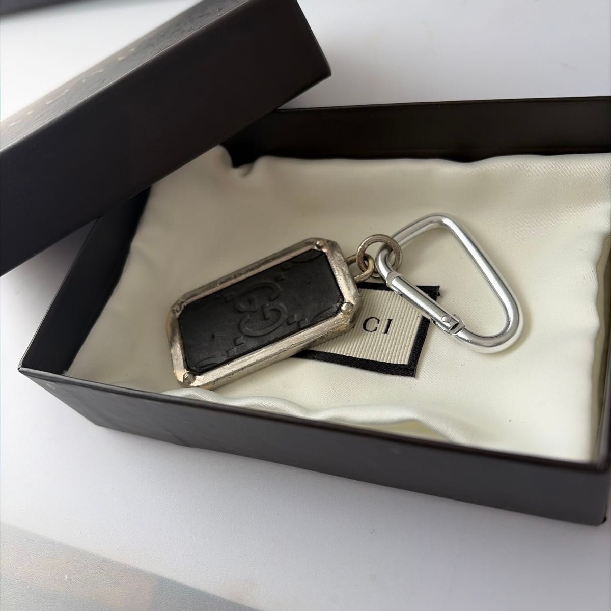 GUCCI GG pattern keychain/key ring, black and silver.