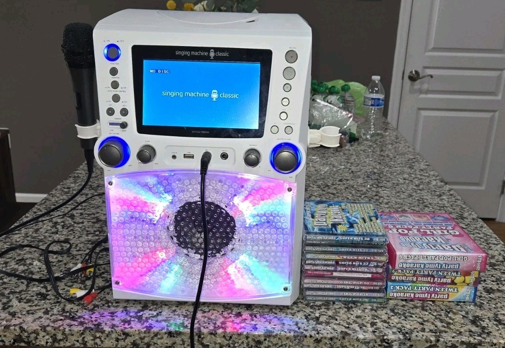 Singing Machine STVG785W Karaoke 7" Color Monitor & 23 CD+G Disc Party Bundle