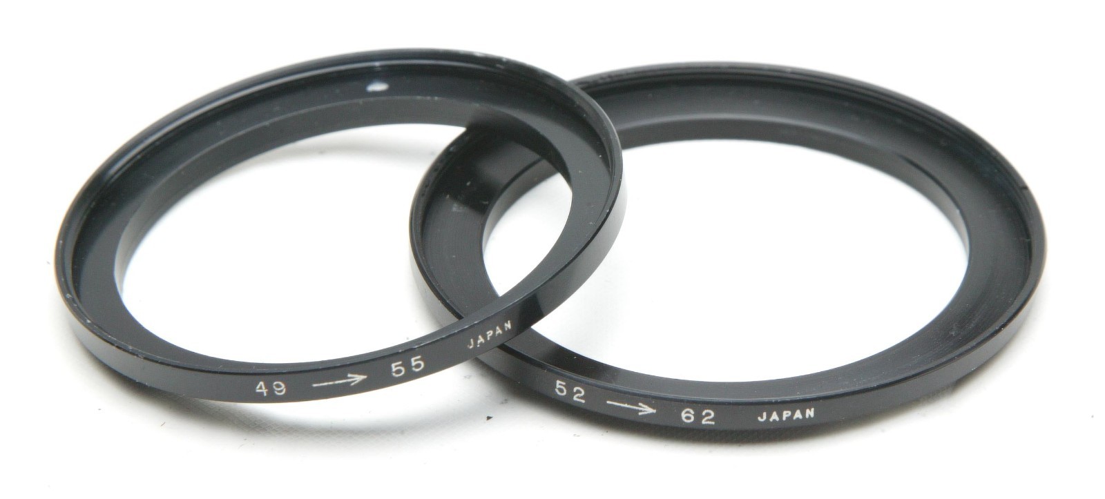 Two Threaded Filter Adapters 49-55mm & 52-62mm. Made In Japan. Clean.