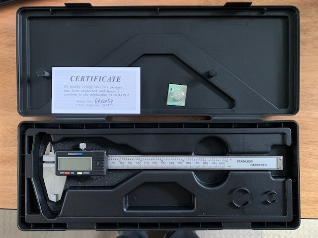 Digital slot caliper used for water ski fin adjustment.