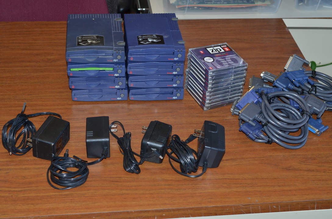 lot of 8 vintage Iomega Zip drive 100 with connecting cables discs power supply