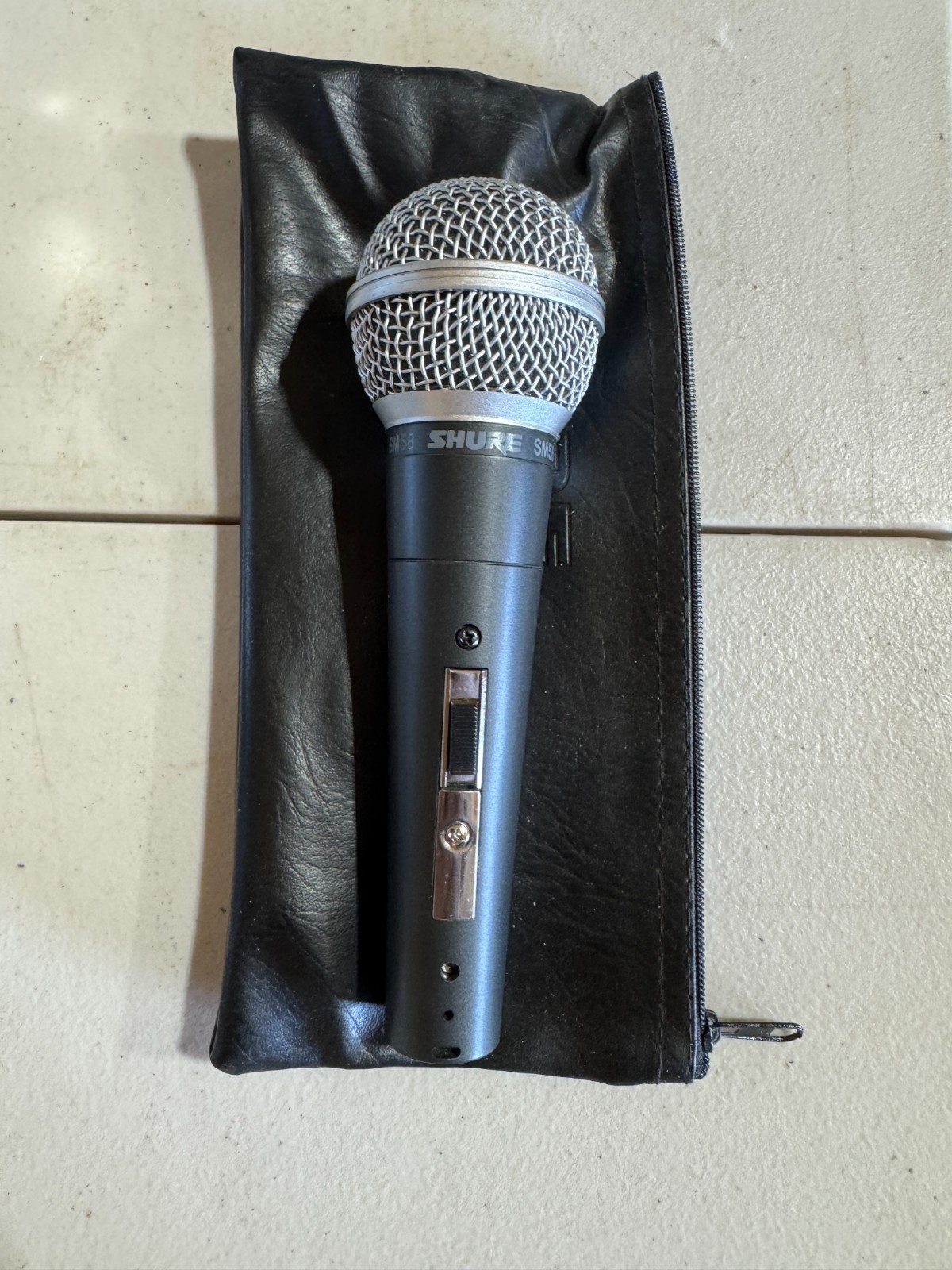 Shure SM58 Microphone with bag in good condition.
