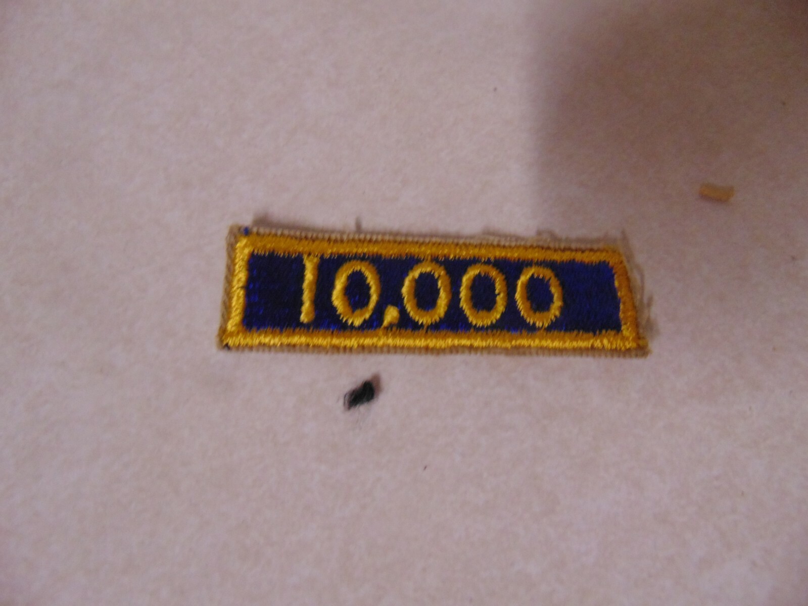 MILITARY PATCH US ARMY SHOULDER TAB SEW ON 10,000 BLUE AND YELLOW OLDER