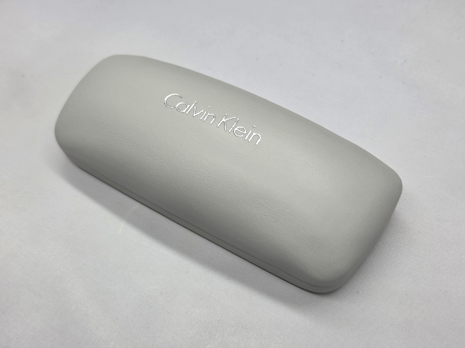 Calvin Klein Light Gray Clamshell Eyeglass Case