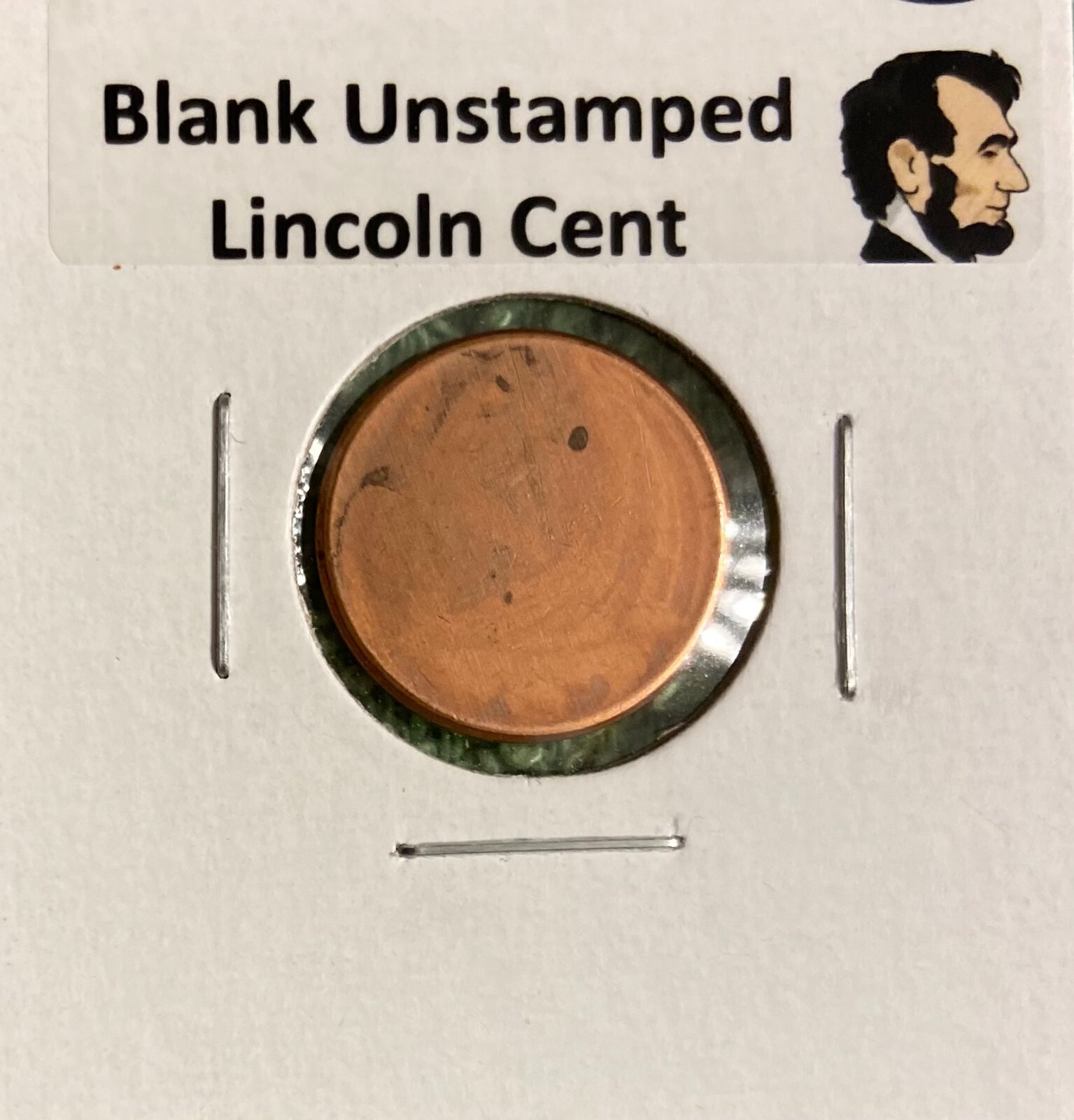 BLANK UN-STRUCK UNCIRCULATED LINCOLN CENT - MINT ERROR - IN HOLDER