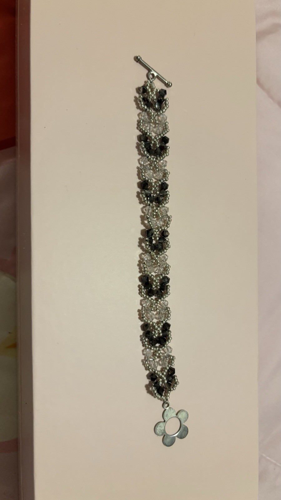 Beaded Bracelet with Black Clear Silver Flower Dangle Charm Toggle Closure