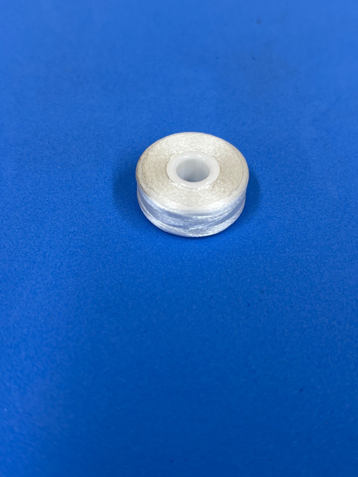 Sideless White Polyester Prewound Bobbin Thread, 144pcs, 145 yds, Size L,