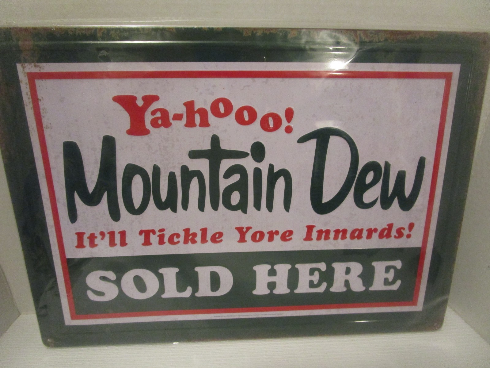 Mountain Dew Sold Here It'll Tickle Yore Innards Embossed Tin Sign 17"x12" Retro