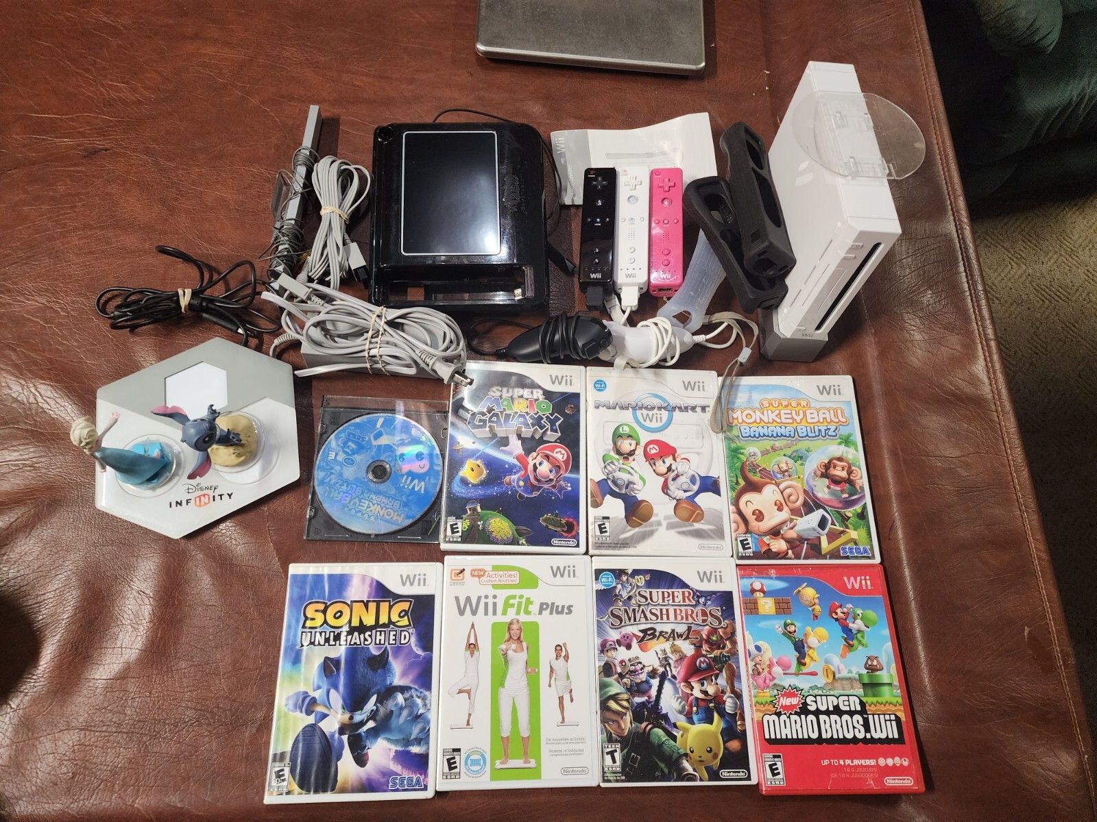 Wii Console plus,  9 games, 2 remotes, 1 nunchuck, System Plus Hookups & More