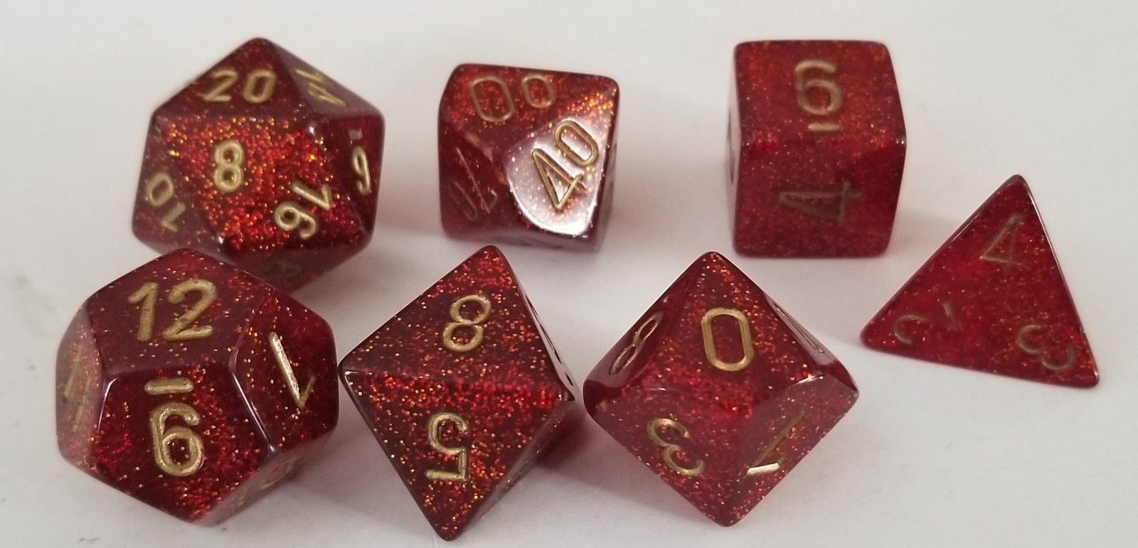 Chessex D&D Dice set of 7, Glitter Ruby (Red Dice with Gold Numbers)