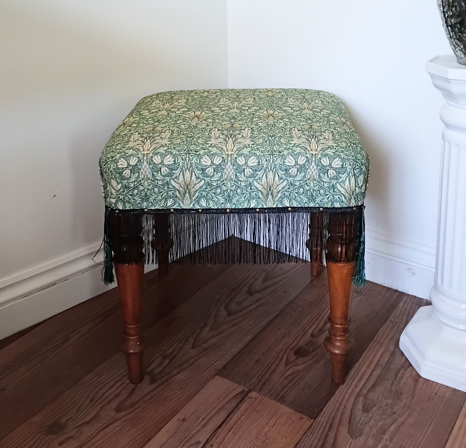 Victorian turned wooden leg stool reupholstered in green Morris Snakehead fabric
