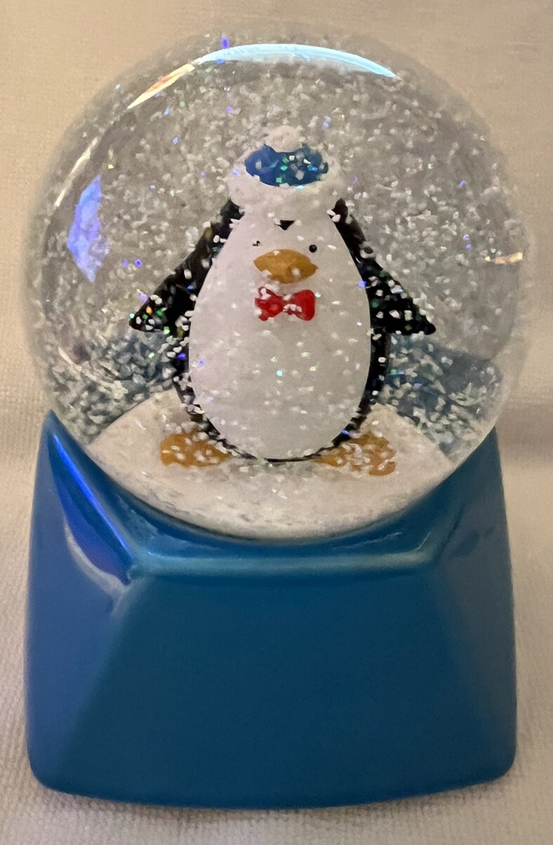 penguin Musical clear snow globe 6” Play’s Jingle Bells Blue Base Christmas