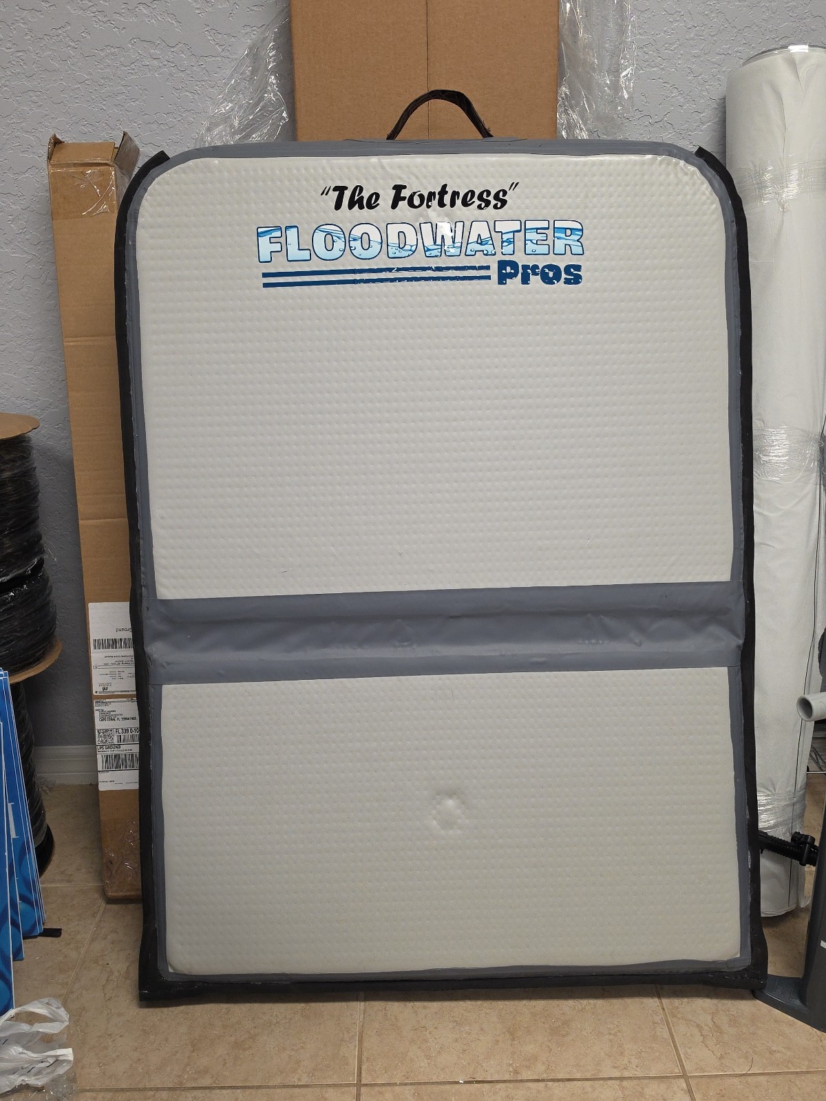 Inflatable flood barrier