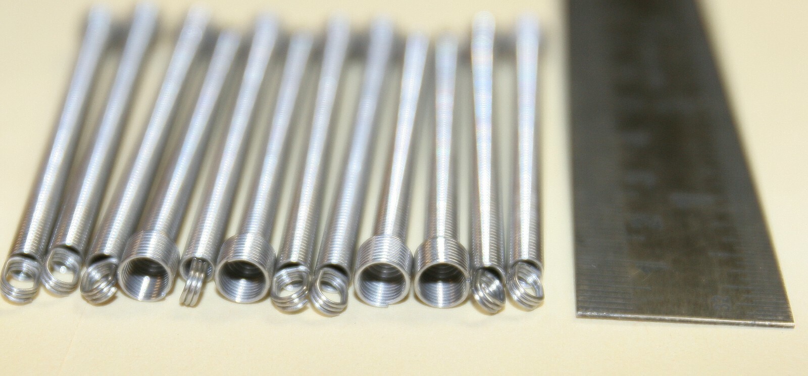 ESD coin chute return spring replacements - 12 pack - part no. 20963