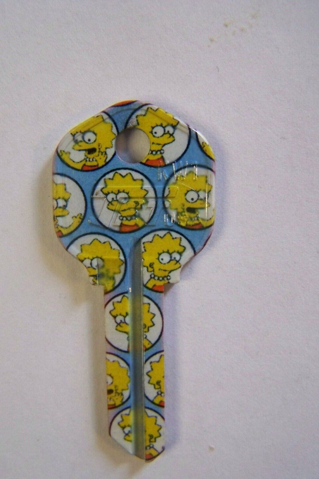 The Simpsons Lisa Kwikset KW1 house key blank.