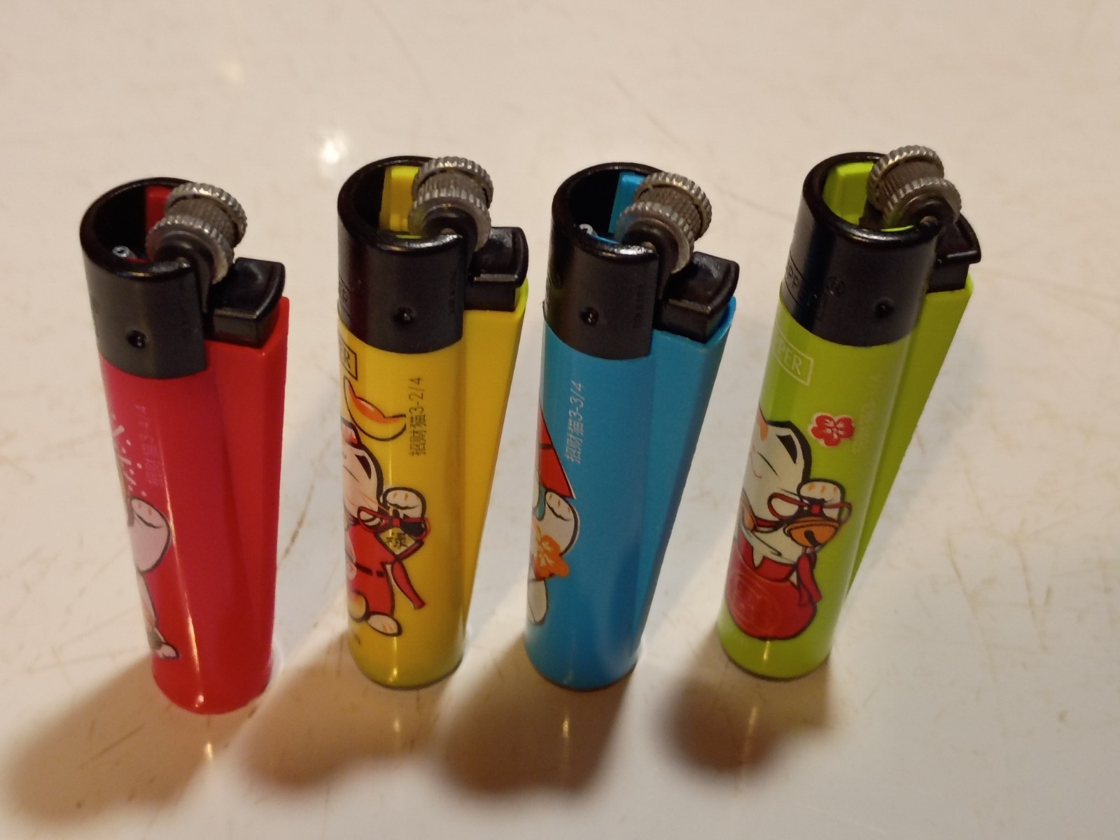 Clipper 4 pk Multicolor "Happy Cat" Refillable Lighters, Small