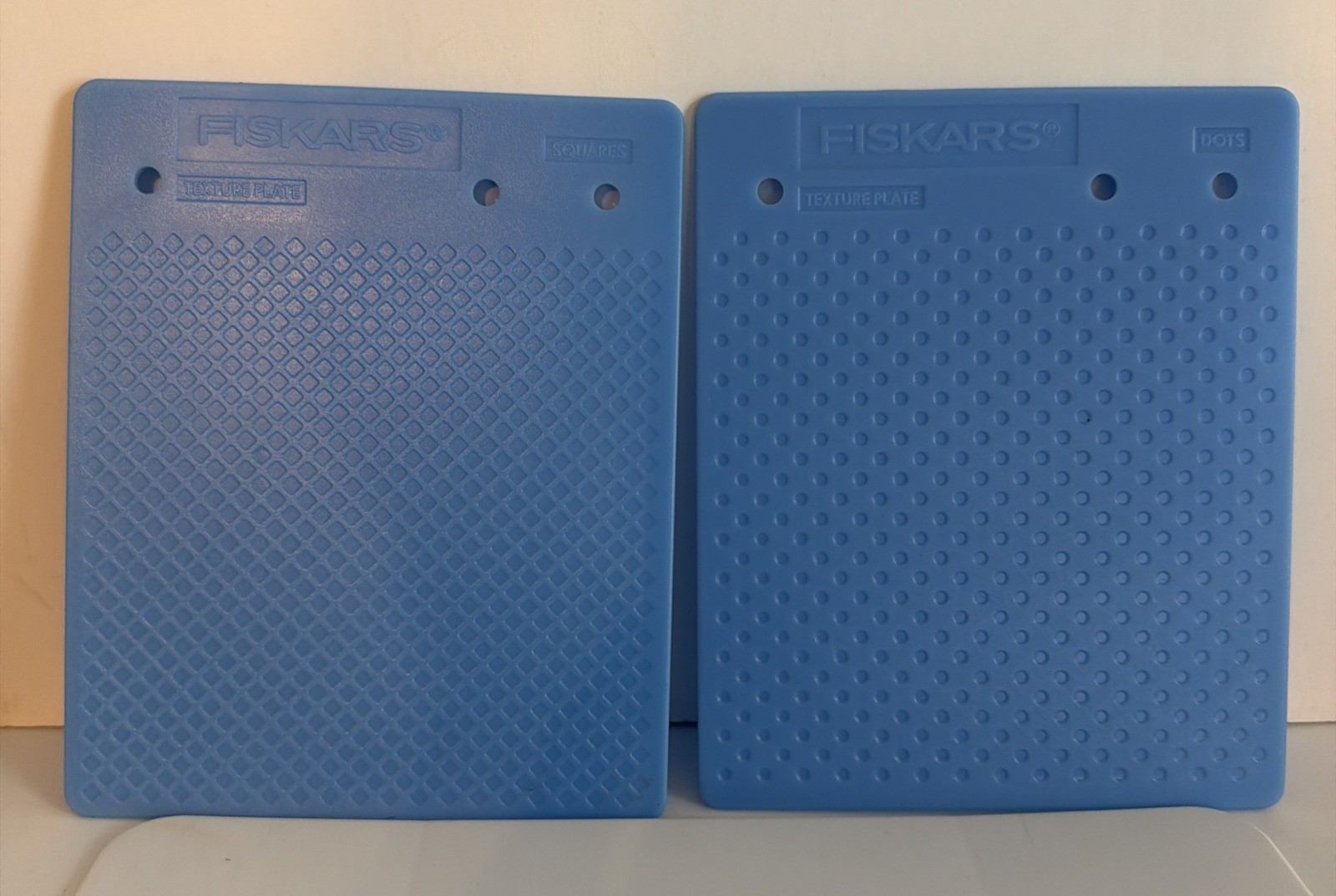 Fiskars Texture Plates set of 2 - 7” x 5 3/4” Dots, Bubbles, Square and Fabric.