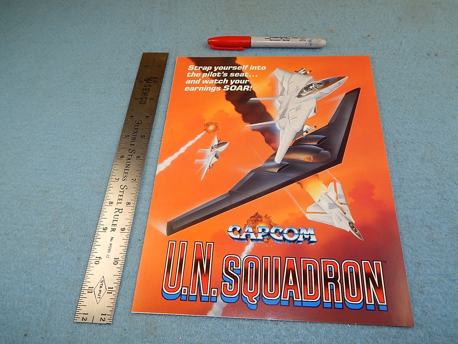 1989 Capcom U. N. SQUADRON video game advertising flyer